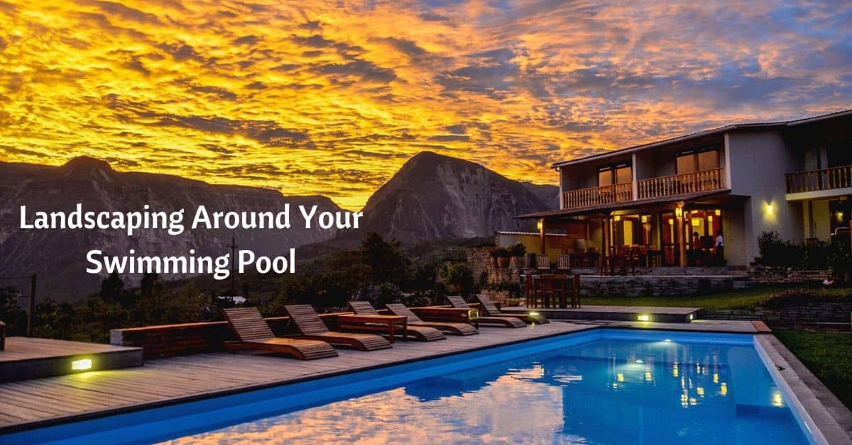 swimming pool behind house with majestic mountains behind. cloud roll in at sunset. text reads landscaping around your swimming pool
